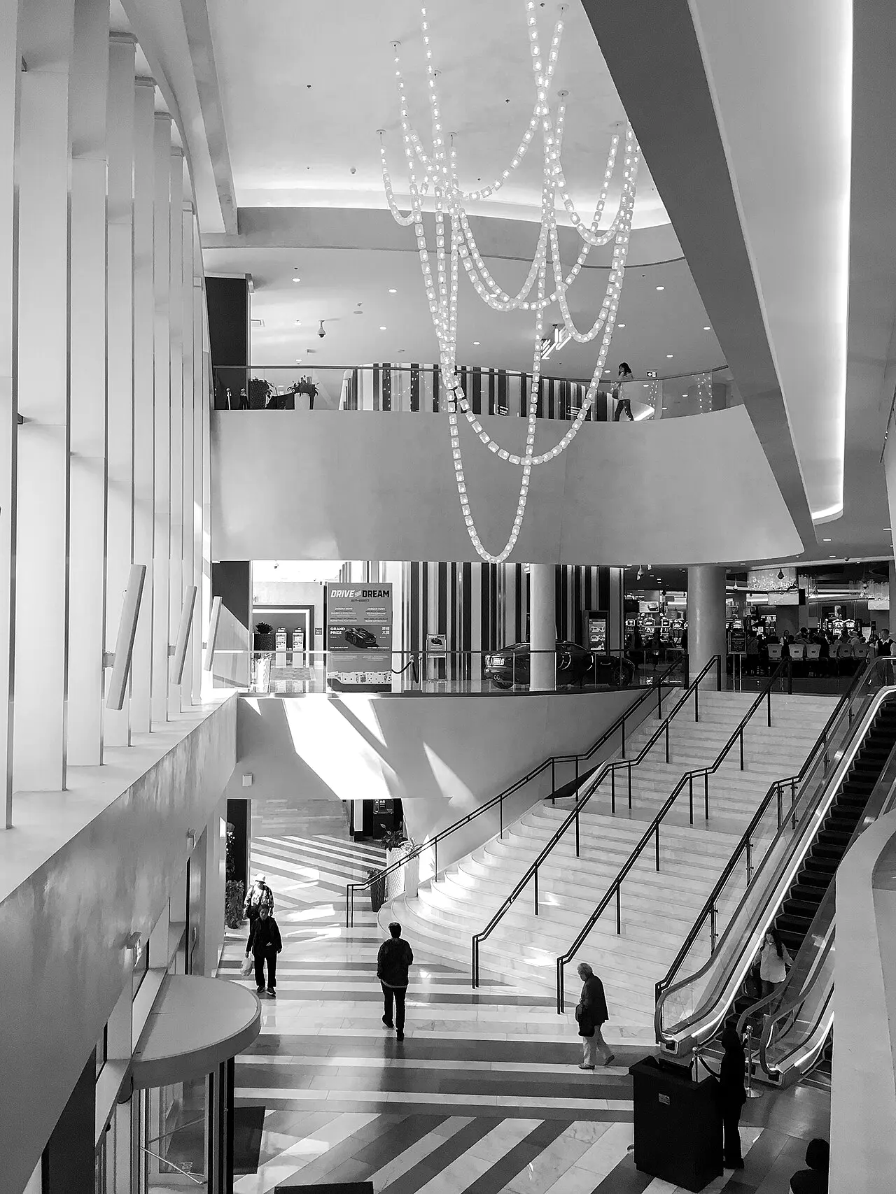 The tall lobby atrium at Parq Vancouver with escalators to the casino levels